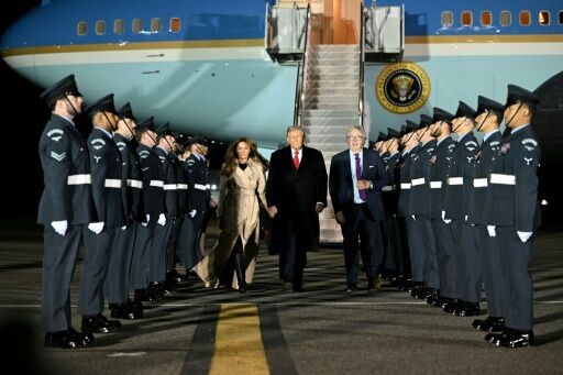 US President Donald Trump (C) and US First Lady Melania Trump disembark from Air Force One after landing at Stansted Airport, eastern England, on September 16, 2025, on the first day of a two-day visit to the UK. US President Donald Trump arrived in the...